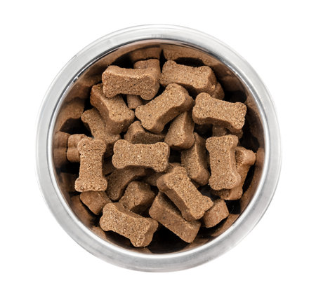 Metal bowl with dog food on a white background. view from above. Food for dogs and catsの写真素材