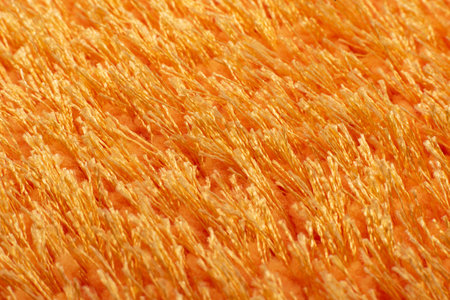 Texture of orange terry bath towel. Carpet backgroundの写真素材