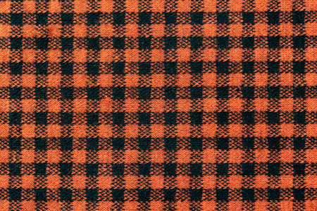The texture of linen fabric in a large cell of black and brown. Scottish tailoring material. checkered fabricの写真素材
