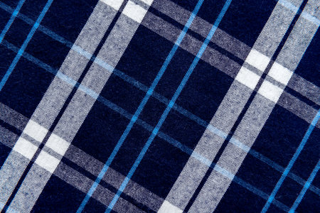 The texture of linen fabric in a large cell of blue and white. Scottish tailoring material....
