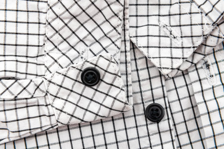 Men's shirt. Plaid shirt sleeve with buttons. Piece of clothing. button