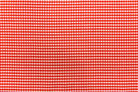 The texture of linen fabric in a large cell of red and white. Scottish tailoring material. checkered...