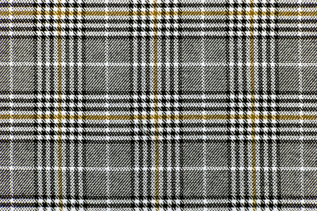 The texture of linen fabric in a large cell of black, brown and white. Scottish tailoring material. checkered fabricの写真素材