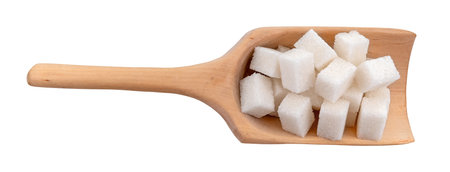 Sugar cubes in a scoop on a white background close-up. view from above. sugarの写真素材