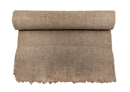 Burlap texture. A piece of torn burlap on a white background. Canvas. Packing materialの写真素材