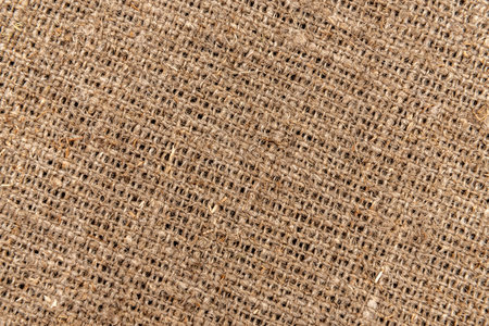 Burlap texture. A piece of torn burlap on a white background. Canvas. Packing materialの写真素材