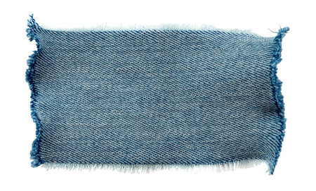 Piece of torn denim on a white background. Denim textureの写真素材