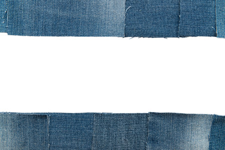 Hole in denim on a white background. Ripped jeansの写真素材