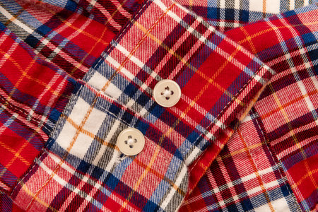Men's shirt. Plaid shirt sleeve with buttons. Piece of clothing. Button