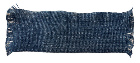 Piece of torn denim on a white background. Denim texture