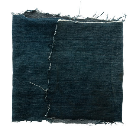 Piece of torn denim on a white background. Denim texture. Pocket