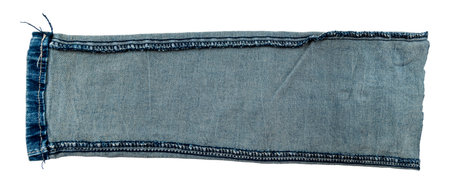 Piece of torn denim on a white background. Denim texture