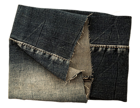 Piece of torn denim on a white background. Denim textureの写真素材