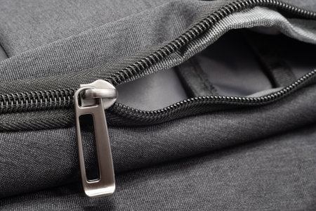 Lock with zipper on clothes. Black padlock with zipperの写真素材