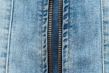 Close-up of a zipper on jeans.