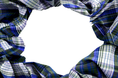 Hole in checkered fabric. Fabric frame on white background. Textile with empty space for inscription or logoの写真素材