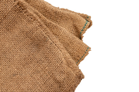 Burlap texture. A piece of torn burlap on a white background. Canvas. Packing materialの写真素材