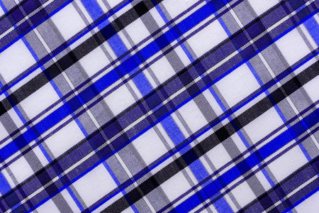 The texture of linen fabric in a large cage of blue and white. Checkered fabric