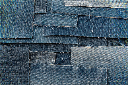 Texture from torn pieces of denim. Jeans texture. Material for sewing clothesの写真素材