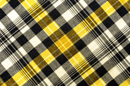 The texture of linen fabric in a large cage of yellow and white. Checkered fabricの写真素材