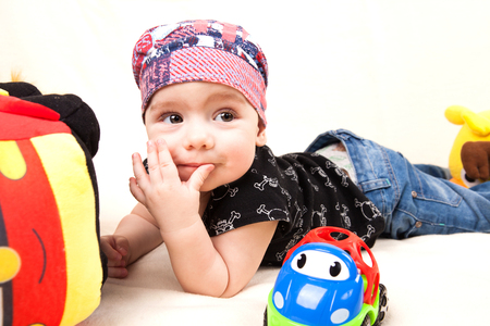 Brovary, Ukraine - March 04, 2018: Boy with toys on a white background.の写真素材
