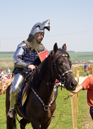 KHOTYN - APRIL 30: Knight in armor riding on horseback - Medieval Khotyn Festival. April 30, 2012. Khotyn. Ukraineのeditorial素材