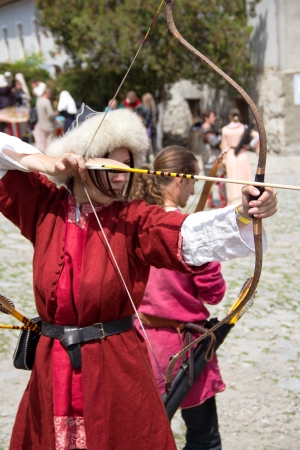 KAMYANETS-PODILSKY- JUNE 2: Shooting archer during Forpost (The Outpost) Festival of Medieval Culture on June 2, Ukraineのeditorial素材