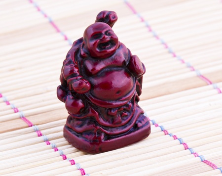 Netsuke red figure  Vintage statue   Close upの写真素材