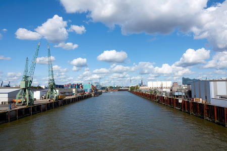 The seaport of Hamburg on a sunny summer day. Blue sky with beautiful clouds.の写真素材