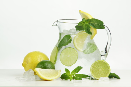 Ice lemonade with lemon, lime and mint on white background.の写真素材