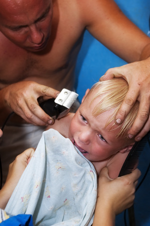 Father son cutting hair. Country lifeの写真素材