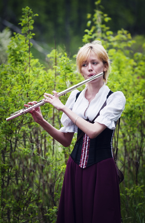 Girl with a flute. "Beltane". Annual role festival dedicated to the Celtic festival of love, spring and fertility. Orenburg, Russia. 05/16/2015のeditorial素材