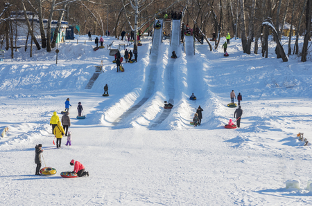 Skating with the hills in the winter. Ural River bank, Orenburg, Russia. 02/04/2017のeditorial素材