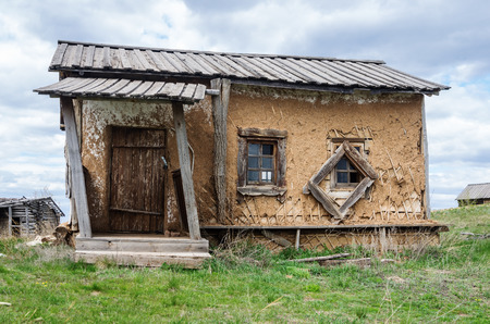 Old hut house / The picture was taken in the scenery remaining from the filming of the feature film "Russian Riot". Russia, the Orenburg region, the village of Saraktash, Krasnaya Gora. 05/06/2017のeditorial素材