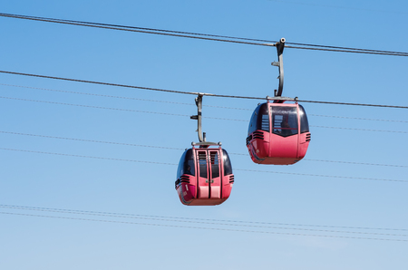 Cabins of a cable car over the Ural River. The picture was taken in Russia, in the city of Orenburg. 04/17/2018のeditorial素材