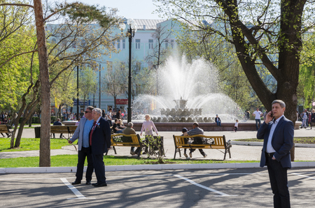 Orenburg, Russia-09 may, 2018:The townspeople having a rest near a fountain in a park at the House of Councils.のeditorial素材