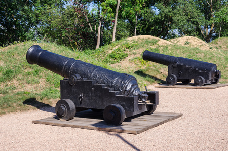 Ancient ship cannons. Russia, the Republic of Crimea, the city of Sevastopol. 06/10/2018: Antique cast-iron muzzle-loaded guns on Malakhov Hillのeditorial素材