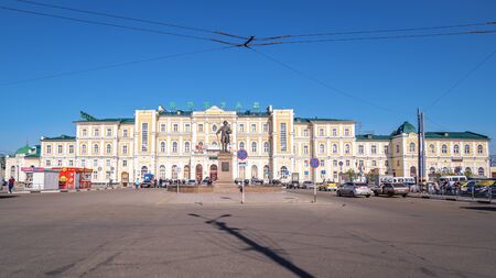 Monument to Rychkov, Peter Ivanovich. Orenburg, Russia - May, 8, 2019: Rychkov Monument on Railway Station Square in the background of the facade of the old railway station buildingのeditorial素材