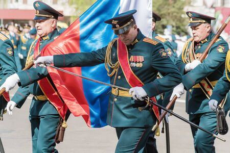 Officer of the banner group, sheathes his saber. Orenburg, Russia - May 9, 2019: Victory Parade on Lenin Squareのeditorial素材