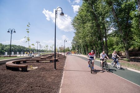 Orenburg, Russia - June, 1, 2019: Embankment of the Urals. Summer. Cyclists riding the bike pathのeditorial素材