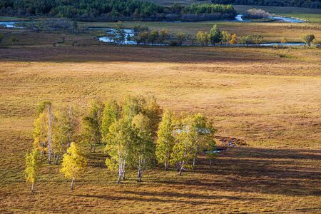 Rural autumn landscape with a river. Russia, Altai Mountains, Ongudaysky district, Uch Enmek Natural Park, Ursul Riverの写真素材