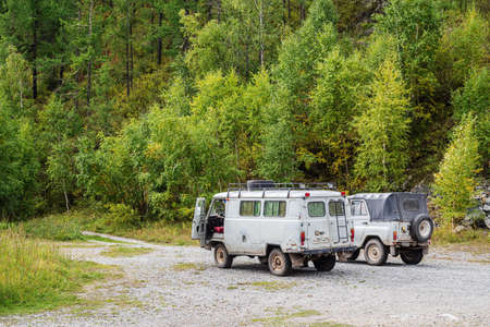 Chike-Taman Pass, Altai Mountains, Russia - September, 13, 2019: UAZ off-road vehicles at the...