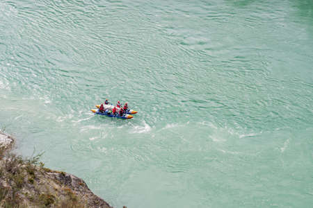 River Katun, Altai Republic, Russia - September 13, 2019: tourists-rafters rafting on mountain river