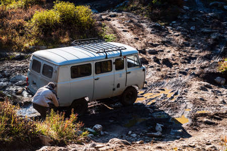 Kosh-Agachsky District, Altai Republic, Russia - September, 16, 2019: A man takes off-road vehicles on his phoneのeditorial素材