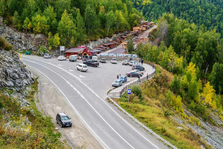 Chike-Taman Pass, Altai Mountains, Russia - September, 13, 2019: Roadside market, car parking and viewing platformのeditorial素材