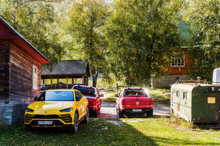 Kirsai camp site, Lake Teletskoye, Altai Republic, Russia - September 20, 2019: Lamborghini Urus and Volkswagen Amarok cars in a parking lot at a campsite during a motor rally in Altaiのeditorial素材