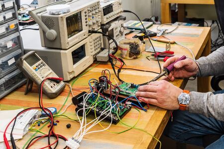 Electronic Engineer at work. Work tools and equipment. The picture was taken in the technical department of the plantの写真素材