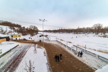 Orenburg, Russia - January, 19, 2020: View from the bridge to the embankment of the Ural River in...
