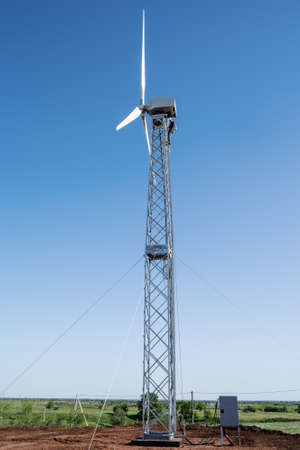 Orenburg, Russia - May, 26, 2020: Adjustment work on a new wind turbine in the countryside