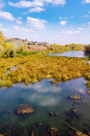 Sakmara river and Red Mountain camping on the shore. The picture was taken in Russia, in the Orenburg region, in the village of Saraktashの写真素材
